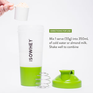 A person is holding a spoonful of vanilla shake powder close to an opened IsoWhey shaker with the text 'Directions for Use'.