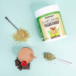 An overhead shot of IsoWhey Plant-Based Meal Replacement Chocolate Shake 550g witth a prepared cup and some ingredients