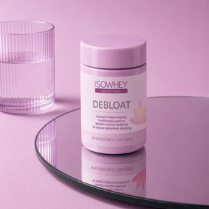 ISOWHEY Debloat supplement container on a pink surface with a glass of water.