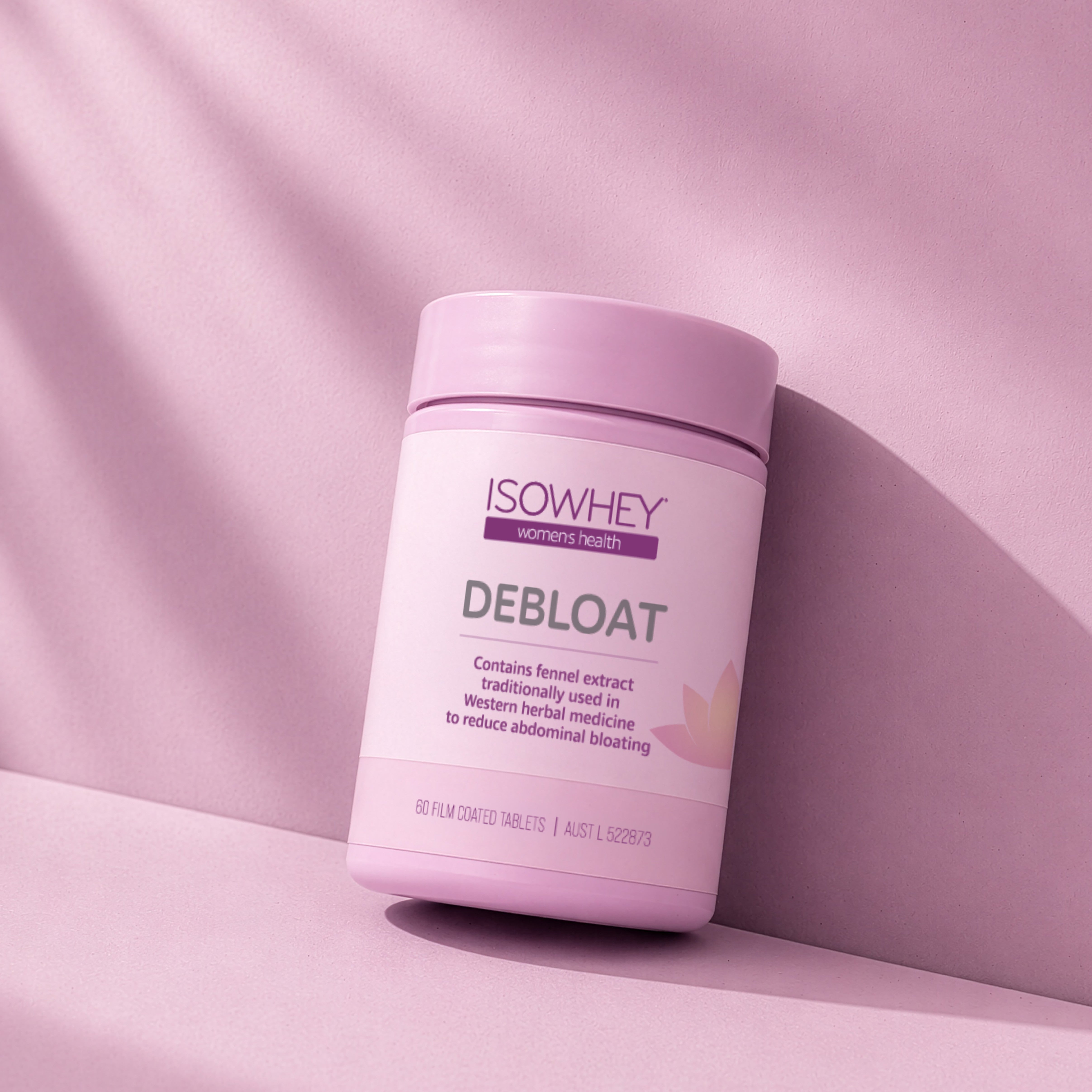 ISOWHEY Debloat supplement container on a pink background