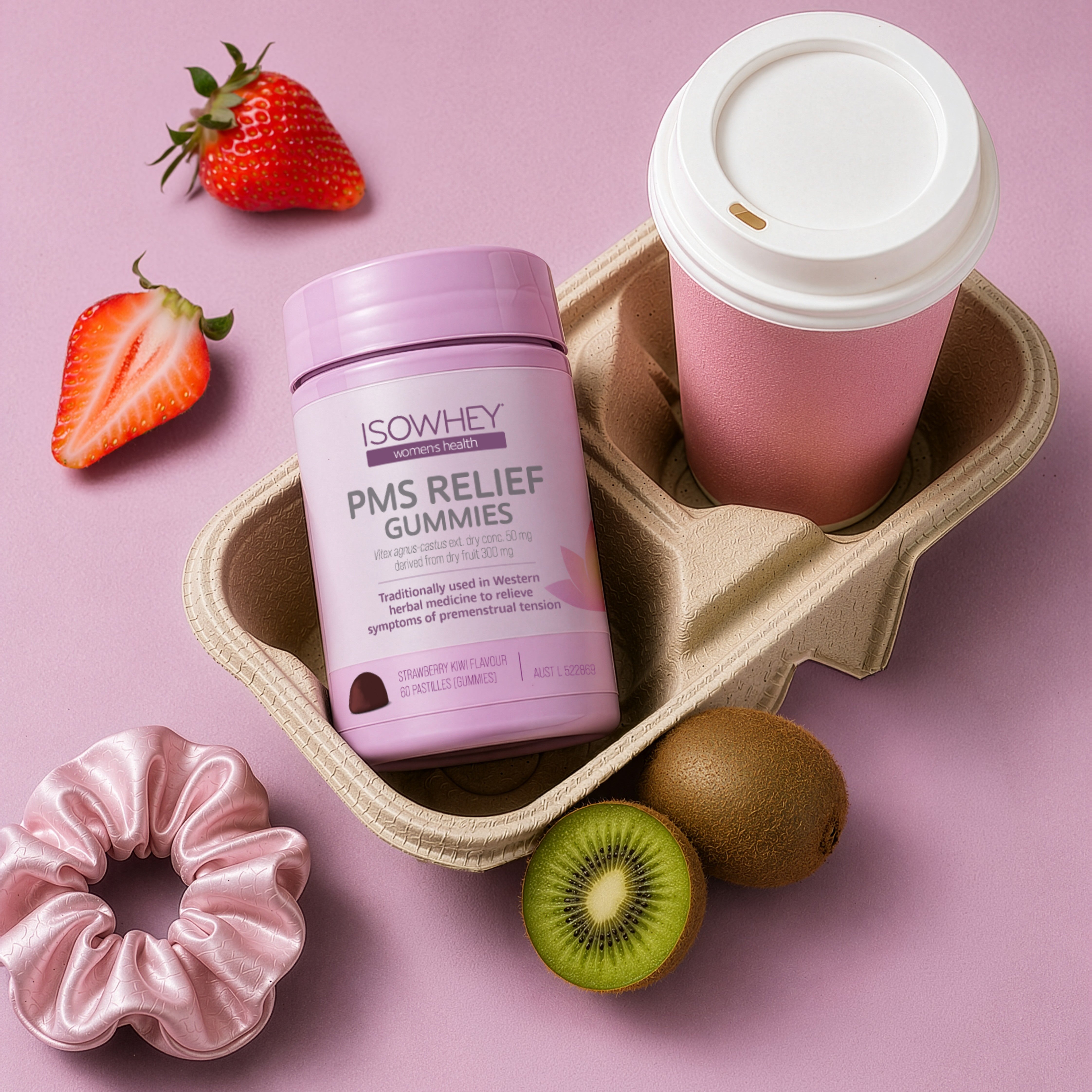 ISOWHEY PMS Relief Gummies with a pink cup, strawberries, and kiwi on a pink background