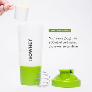 A person is holding a spoonful of vanilla shake powder close to an opened IsoWhey shaker with the text 'Directions for Use'.